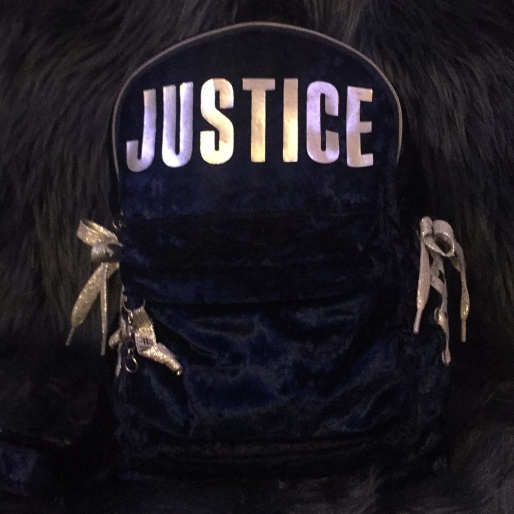 Navy blue mini Justice backpack with two bows.